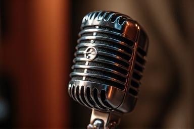 Close-up of a vintage microphone capturing sound