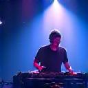 Dynamic photo of DJ Anya performing with lights